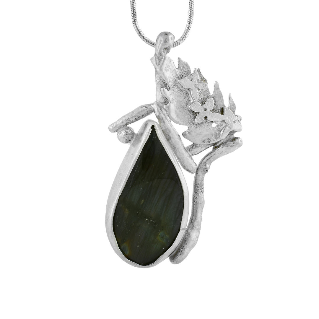 Labradorite teardrop shape molded into 925 Silver with nature like texture making it look like a drop of rain falling off a leaf.