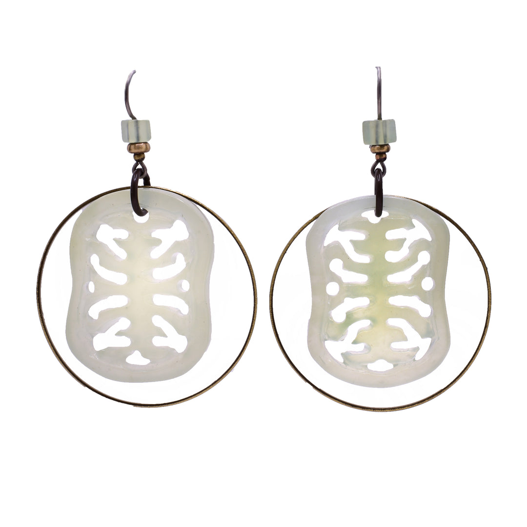 Large, carved celadon jade dangle earrings with brass hoops. Titanium ear hooks.
