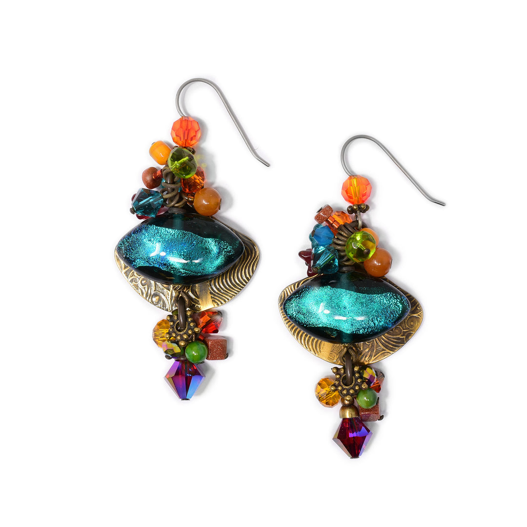 Made of Swarovski crystal, hand worked brass, glass, amber, goldstone, mother of pearl, lampworked glass and carnelian agate. Titanium ear hooks. By Honica.