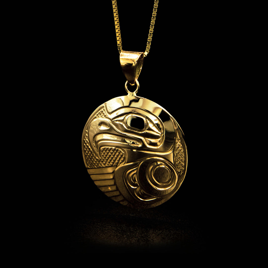 Pendant features side-view of eagle’s head and torso with outstretched wing. Eagle done in lines and ovoids. Background is cross-hatching. Plain, triangular bail.