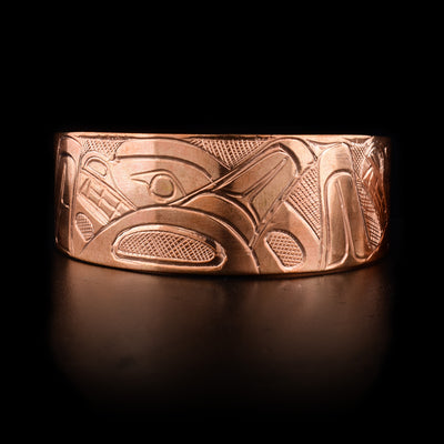 Front of bracelet features swimming orca pod. Hand-carved by Kwakwaka’wakw artist Norman Seaweed.