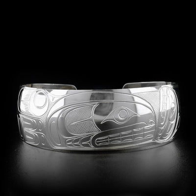 Sterling silver large size orca cuff bracelet. One inch wide. Meticulously hand-carved by Coast Salish artist Travis Henry.