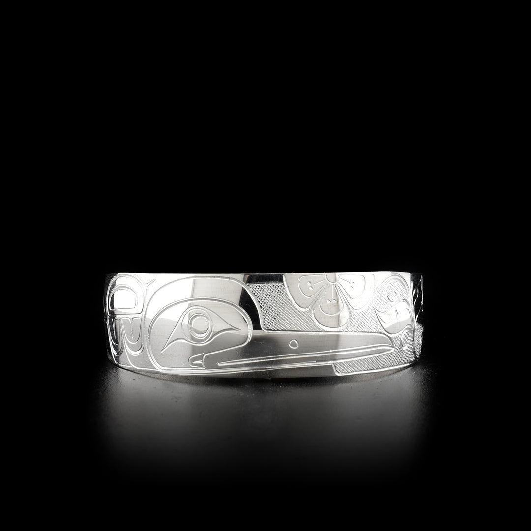 Sterling silver hummingbird cuff bracelet. Three quarters of an inch wide. Meticulously hand-carved by Coast Salish artist Travis Henry.