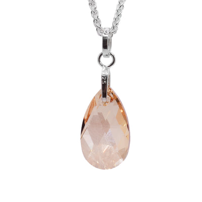 Sterling silver light peach teardrop Swarovski crystal pendant by artist Debra Nelson.