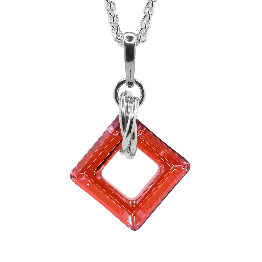 This crystal pendant has a square, cutout persimmon Swarovski crystal with multiple sterling silver hoops forming a chain.
