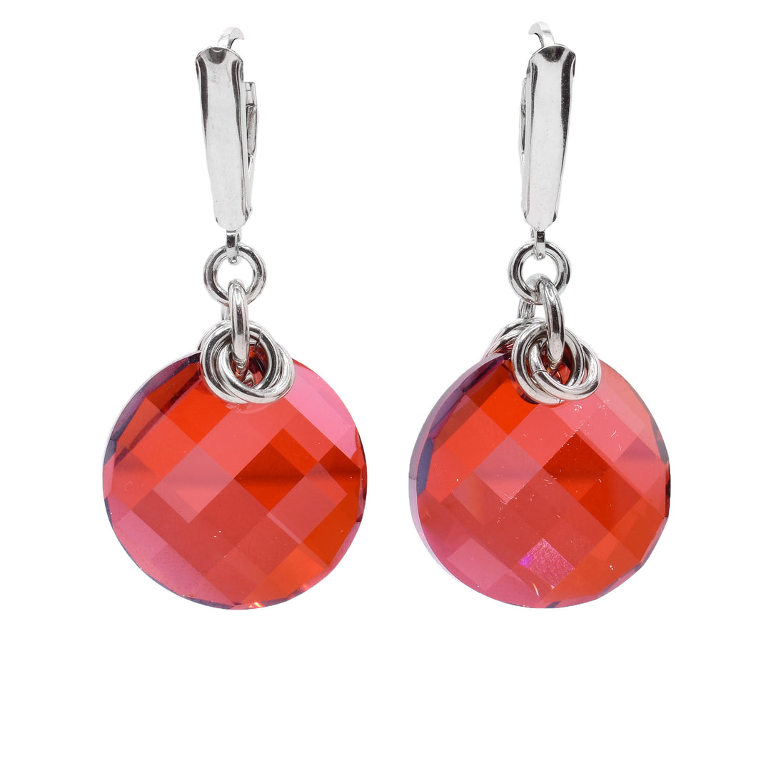 These sterling silver and crystal dangle earrings have circle persimmon Swarovski crystal hangs.
