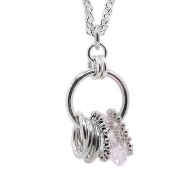 This sterling silver crystal pendant has a large hoop with smaller silver hoops linked through it. There is also an urban smoke Swarovski crystal hoop and silver beaded hoops.
