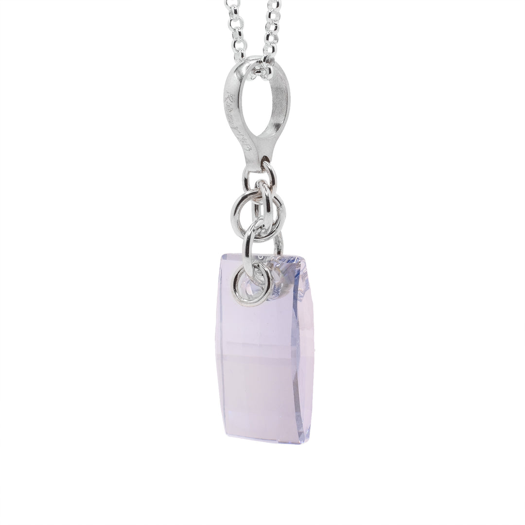 This crystal pendant has a sterling silver jump ring and chain with a rectangular urban blue Swarovski crystal attached to it.