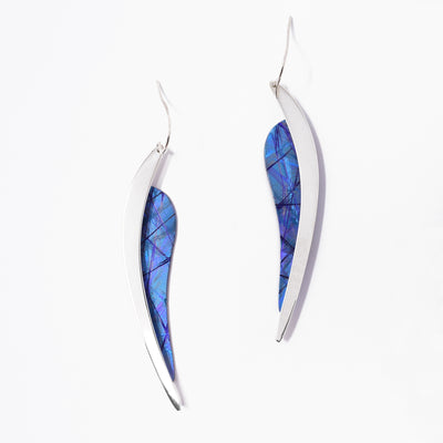 Long leaf-shaped earrings pointing downwards. Made of sterling silver and anodized titanium. Titanium part is a dazzling blue-purple.