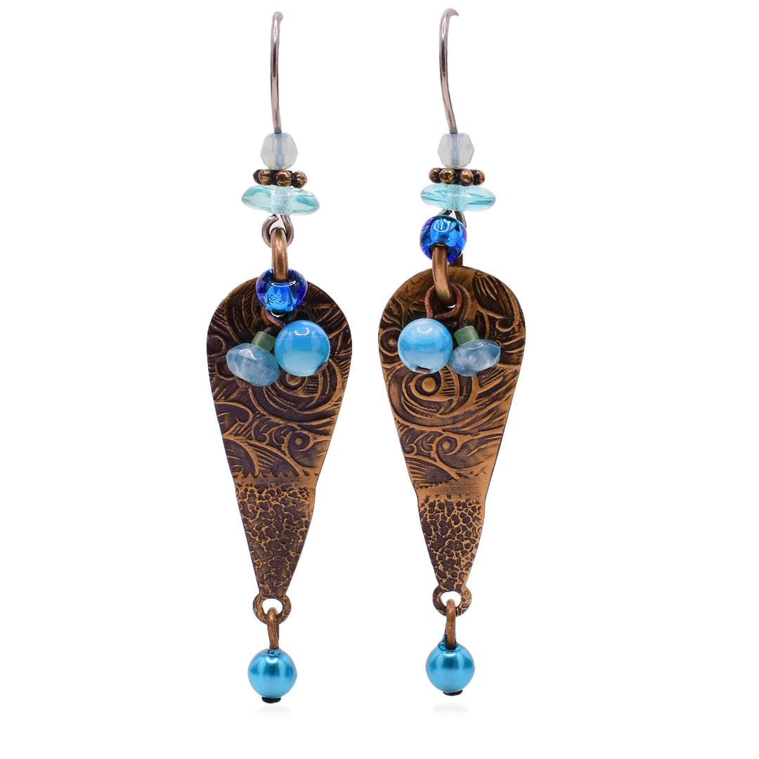 Dangle earrings made of handworked brass, Austrian crystal, mother of pearl, glass and amazonite. Titanium hooks. By Honica.