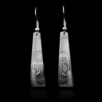 Domed, triangular sterling silver earrings with raven heads facing downwards. Cross-hatching background. Dangle earrings hand-carved by Coast Salish artist Travis Henry.