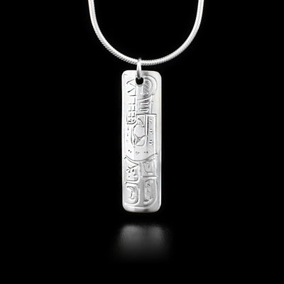 Long sterling silver rectangle pendant depicting wolf.