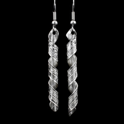 These spiral earrings are a long rectangle, featuring a wolf, twisted into a hanging, vertical spiral.