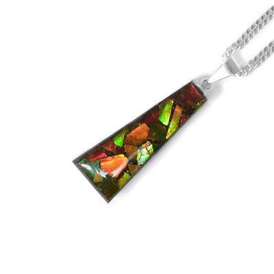 Triangular pendant with sterling silver bail. Ammolite side with pieces of ammolite covered in resin.