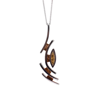 This sterling silver necklace has abstract lines that are connected together with brown patterns.