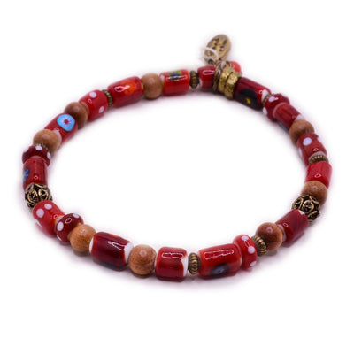 Red beaded bracelet with handmade lampworked glass, brass and wooden beads. By artist Wendy Pierson.