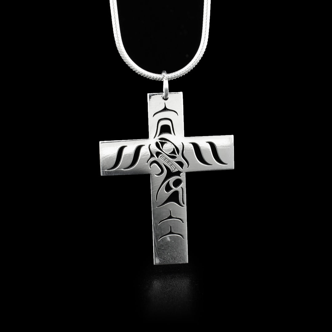 Sterling silver flat, mini wolf cross pendant with pierced design. Wolf is cut out in the center facing the right.