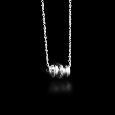 Mini sterling silver coil pendant necklace by artist Joy Annett.