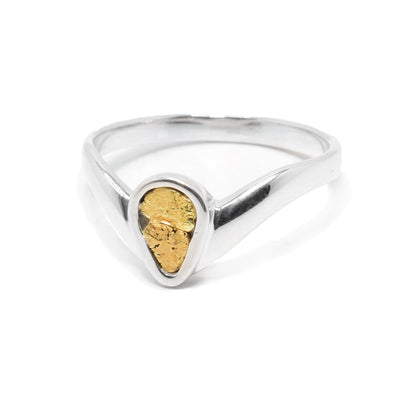 Sterling silver ring with teardrop shape on front filled with 22K gold nuggets. By Tom Gregorczyk.