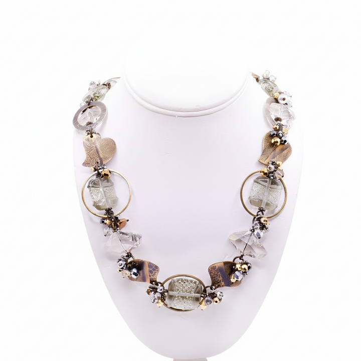 The second photo depicts the beaded necklace on a neck stand. 