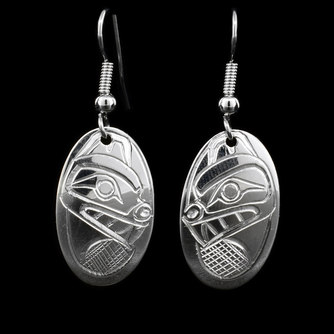 These silver dangle Bear earrings have sterling silver, oval hangs attached to them with the Bear carved into their surface.