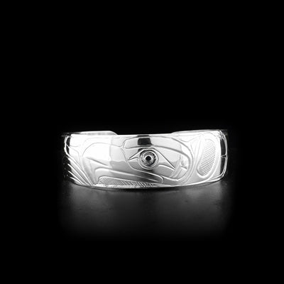 This sterling silver cuff bracelet has a slightly tapered band with a depiction of the Eagle carved into the surface of it.