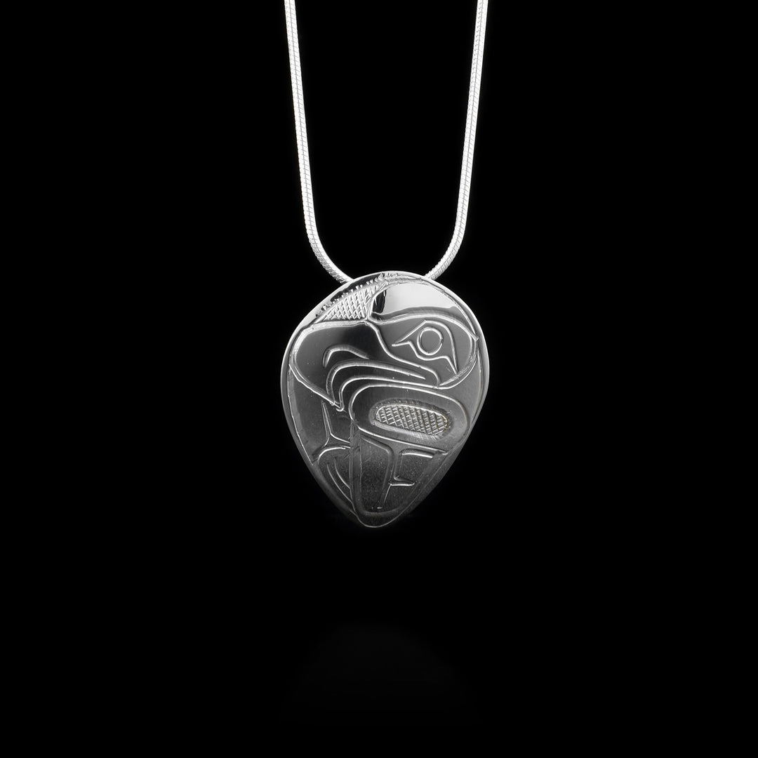 This sterling silver pendant is shaped like an inverse teardrop and there is a depiction of the Eagle carved into the surface of the pendant.
