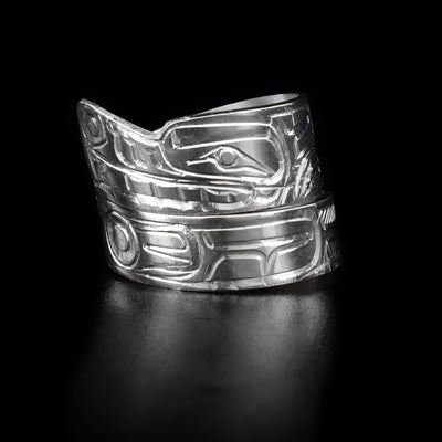 This sterling silver wrap ring has a wolf carved into it and wraps around the finger twice.