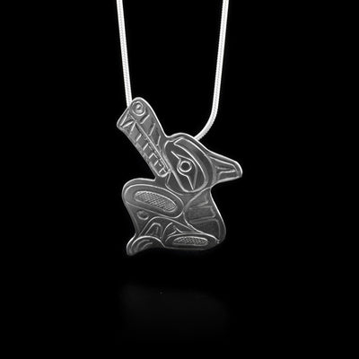 This unique Wolf pendant is made from sterling silver. The piece is shaped like and has carvings on it that depict the Wolf.