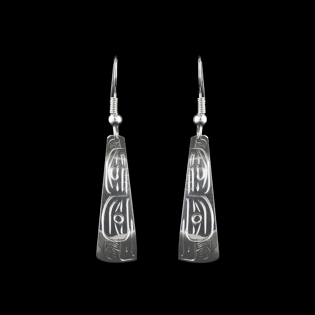 Orca and Eagle Dangle Earrings made with sterling silver the legend of the Orca and Eagle are carved on the surface to represent air and sea.
