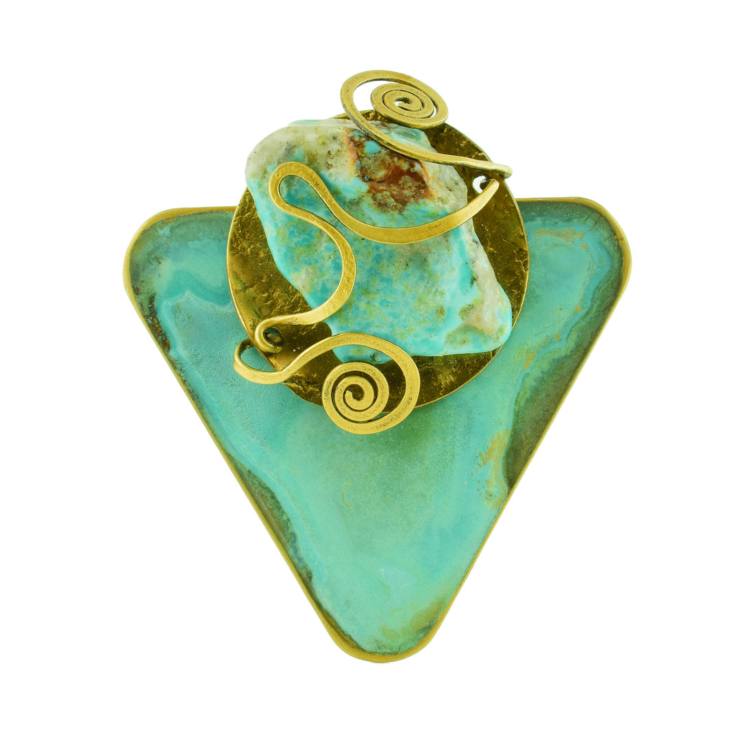 Original Turquoise Brooch - The base is and upside triangle made of brass worked to have a turquoise top coat. On top of that lays a turquoise stone nestle in a brass circle with a wavy belt of brass.