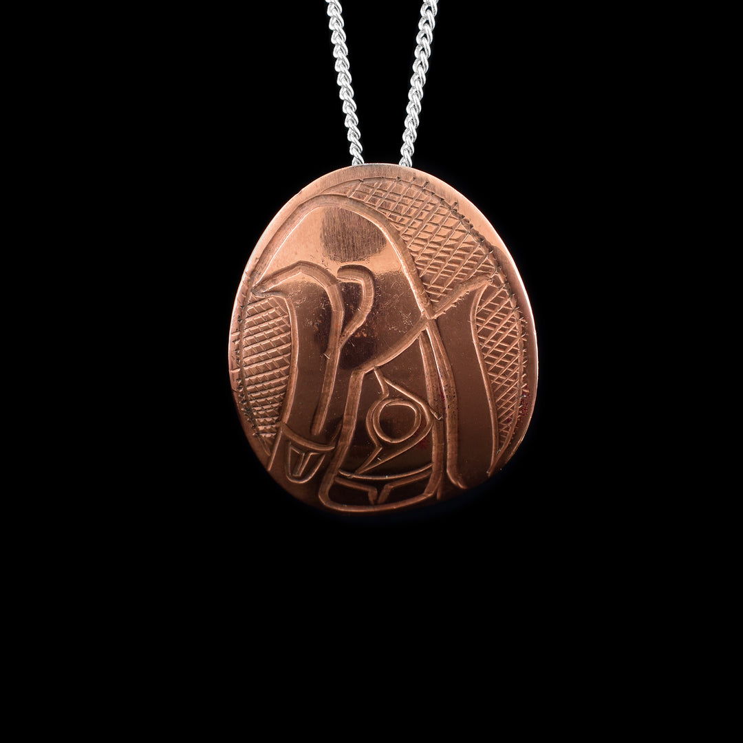Oval Copper Eagle Pendant - The Eagles face is pointing up beautifully carved on the surface.