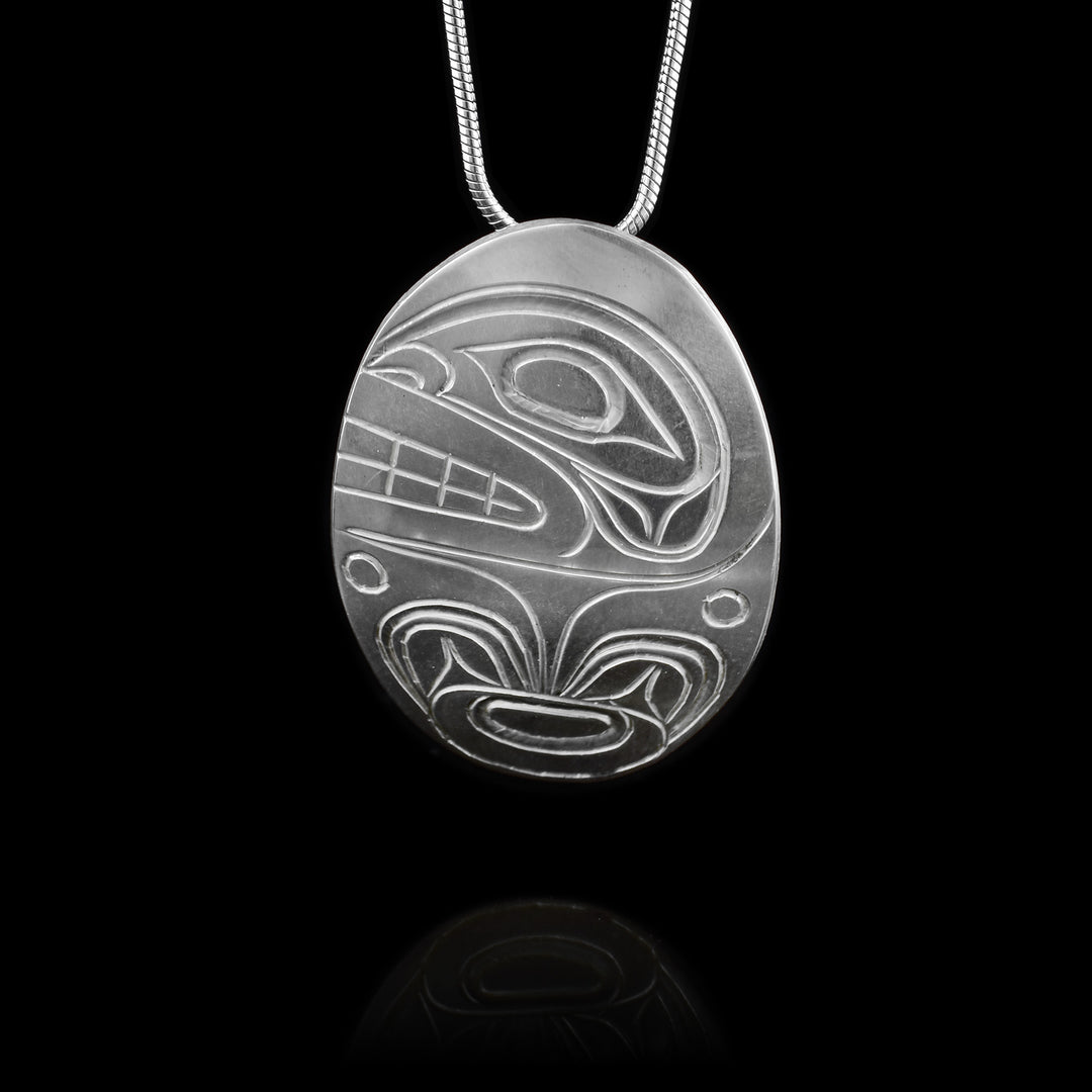 Handcrafted by a Canadian artist, this sterling silver orca pendant honors Indigenous legend and timeless coastal design.