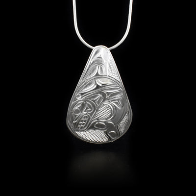 This sterling silver pendant is tear drop shaped and has the Orca carved into it.