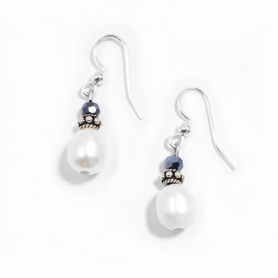 Sterling silver white freshwater pearl and dark blue crystal dangle earrings.