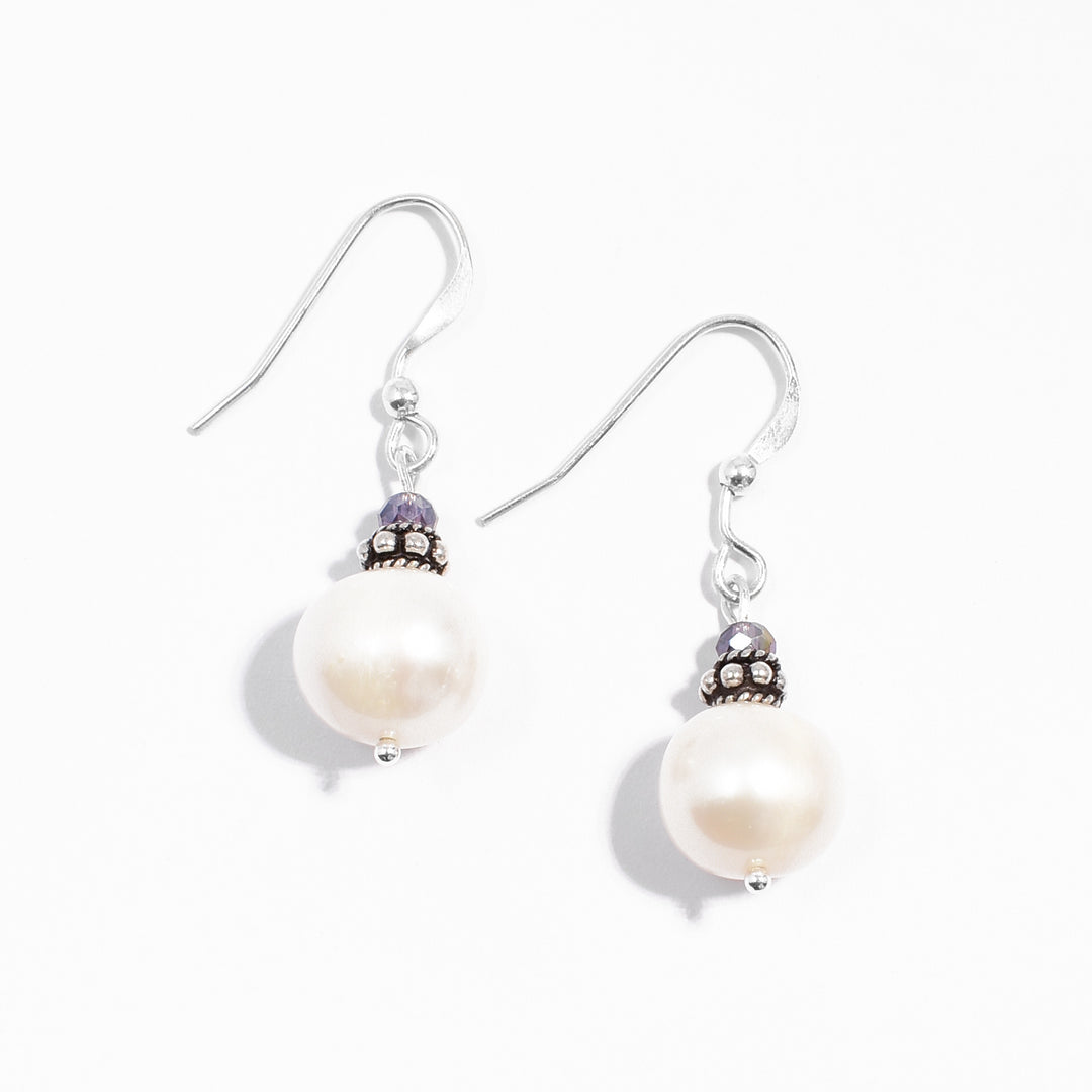 Sterling silver white freshwater pearl and purple crystal dangle earrings.
