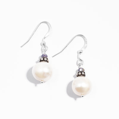 Sterling silver white freshwater pearl and purple crystal dangle earrings.