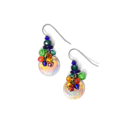 Dangle earrings with colourful hand worked brass circles at bottom and cluster of colourful Swarovski crystal and glass beads above. Titanium ear hooks. By Honica.