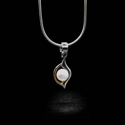 Sterling silver and 14K yellow gold white freshwater pearl pendant.