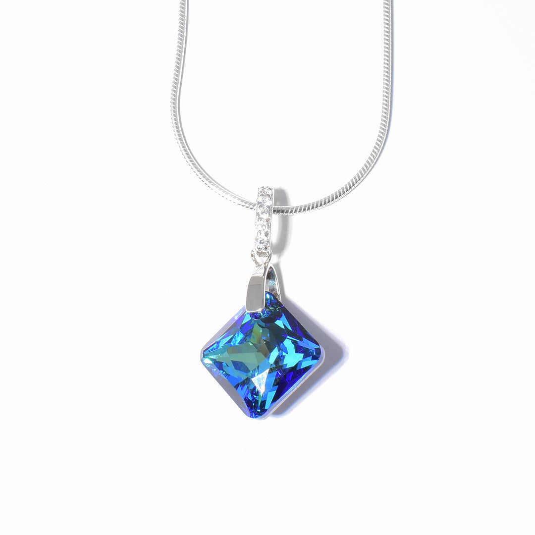 Princess-cut Bermuda Blue Swarovski Crystal. Bail is encrusted with a line of cubic zirconia.