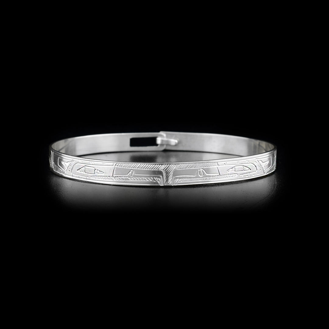 Sterling silver bracelet depicting two eagles facing each other.