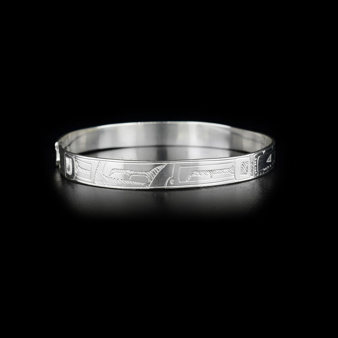 Right side of bracelet with carved designs.