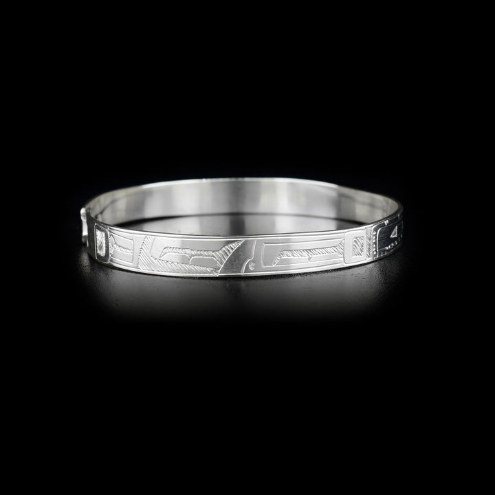 Right side of bracelet with carved designs.