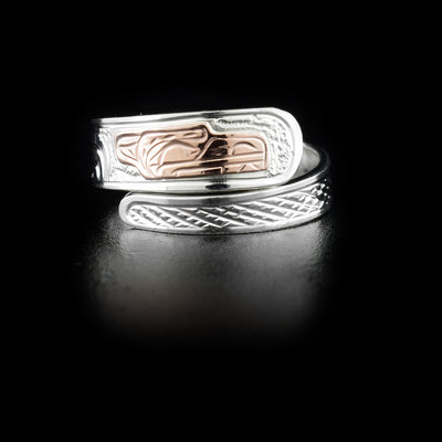 Sterling silver wrap ring with 14K rose gold bear head. Band is 0.25” at its widest. Hand-carved by Kwakwaka’wakw artist Victoria Harper.