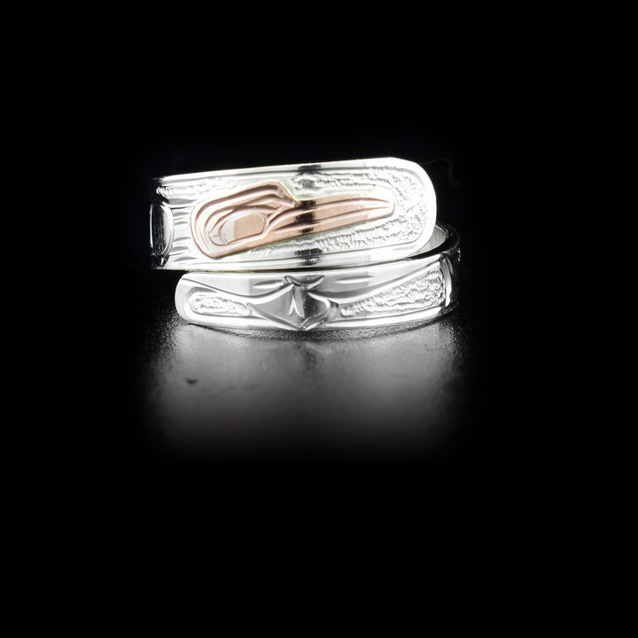 Sterling silver wrap ring with 14K rose gold hummingbird head. Band is 0.25” at its widest. Hand-carved by Kwakwaka’wakw artist Victoria Harper.