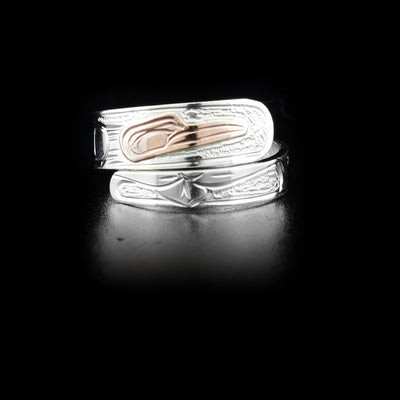 Sterling silver wrap ring with 14K rose gold hummingbird head. Band is 0.25” at its widest. Hand-carved by Kwakwaka’wakw artist Victoria Harper.