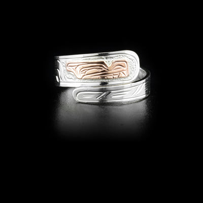 Sterling silver wrap ring with 14K rose gold wolf head. Band is 0.25” at its widest. Hand-carved by Kwakwaka’wakw artist Victoria Harper.