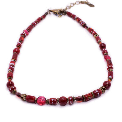 Red beaded necklace with rubies, handmade lampworked glass beads and brass beads. By artist Wendy Pierson.