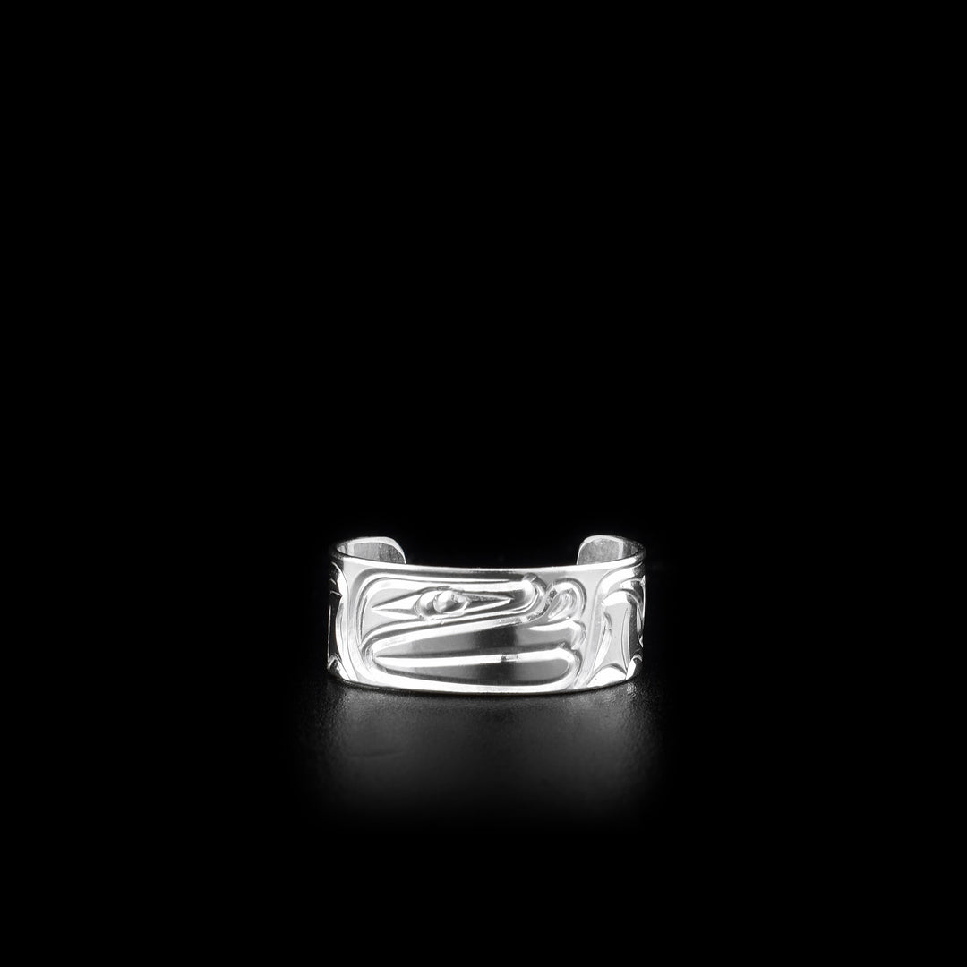 This sterling silver toe ring has a cuff band with a gap in the back. There is a depiction of the Frog that has been carved into the surface of the band.