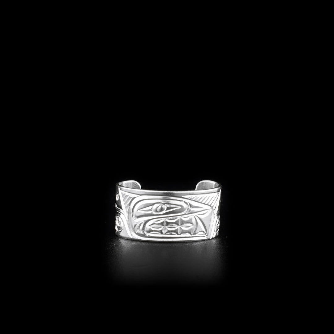 This sterling silver toe ring has a cuff band with a gap in the back. There is a depiction of the Orca that has been carved into the surface of the band.